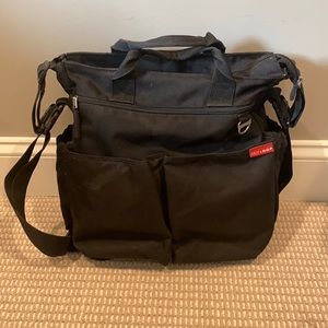 Skip Hop brand black diaper bag.